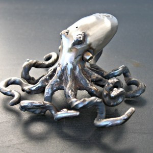 small forged stainless steel octopus sculpture